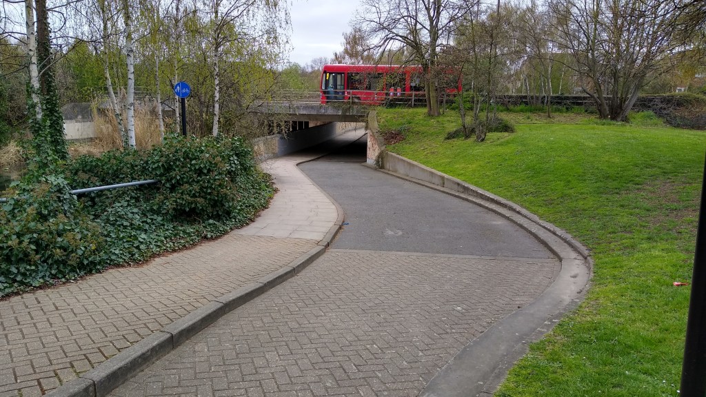 A footway to the left next to a cycle track stepped down at a lower level to the right.